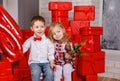 Boy presenting gift to little girl in casual dress. Valentine day Royalty Free Stock Photo