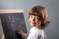 Boy primary school students at blackboard Royalty Free Stock Photo