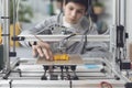 Boy printing a prototype using a 3D printer Royalty Free Stock Photo