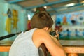 The boy shoots at the shooting range of the gun Royalty Free Stock Photo