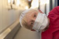 Boy in protective mask rides train compartment. Traveling during a quarantine Royalty Free Stock Photo