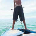 A boy pulling anchor boat