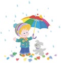 Boy and puppy hiding from the rain under an umbrella