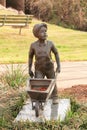 Boy pushing wheelbarrow-statue Children`s Memorial Garden