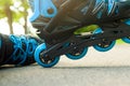 The boy puts on blue roller skates. Sport. Rollers Royalty Free Stock Photo
