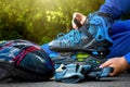 The boy puts on blue roller skates. Sport. Rollers Royalty Free Stock Photo