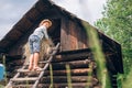 Boy puts the hay in hayloft