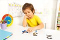 Boy puts learn to count with numbers and values Royalty Free Stock Photo