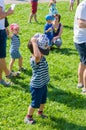 Boy putting hat on Royalty Free Stock Photo