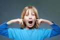 Boy Putting his Index Fingers in his Ears Royalty Free Stock Photo