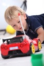 Boy with radio controlled car Royalty Free Stock Photo