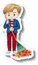 Boy raking leaves cartoon sticker on white background Royalty Free Stock Photo