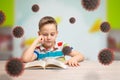 Boy read book and learn at home at the time of the virus corona epidemic Royalty Free Stock Photo