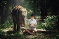 Boy reading book with elephant friend.