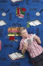 Boy Reading Book On Floor Royalty Free Stock Photo