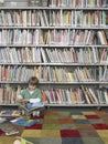 Boy Reading Book In Library Royalty Free Stock Photo