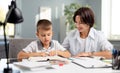 Boy reading book with mother Royalty Free Stock Photo