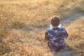 Boy reading book outside at sunset Royalty Free Stock Photo