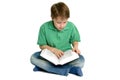 Boy reading crossed legs