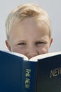 Boy Reading The New Testament Royalty Free Stock Photo