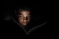 Boy reading at night