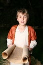 Boy reading a scroll Royalty Free Stock Photo