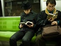 Boy reading in subway