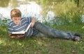 Boy reads a big book Royalty Free Stock Photo