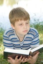 Boy reads book Royalty Free Stock Photo