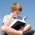 Boy reads book Royalty Free Stock Photo