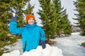 Boy ready to throw snowball during game Royalty Free Stock Photo