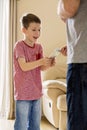 Boy receiving pocket money (allowance) from father Royalty Free Stock Photo