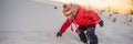 Boy in red fashion clothes playing outdoors. Active leisure with children in winter on cold days. Boy having fun with Royalty Free Stock Photo