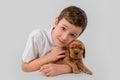 Boy with red puppy isolated on white background. Kid Pet Friendship Royalty Free Stock Photo