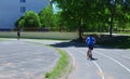 A boy on a red scooter is the only one on the track Royalty Free Stock Photo