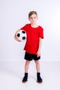 Boy in red shirt with soccer ball Royalty Free Stock Photo