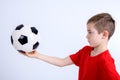 Boy in red shirt with soccer ball Royalty Free Stock Photo