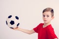 Boy in red shirt with soccer ball Royalty Free Stock Photo