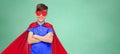 Boy in red super hero cape and mask Royalty Free Stock Photo