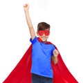 Boy in red super hero cape and mask showing fists Royalty Free Stock Photo