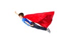 Boy in red superhero cape and mask flying on air Royalty Free Stock Photo