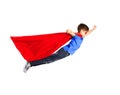 Boy in red superhero cape and mask flying on air Royalty Free Stock Photo