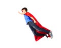 Boy in red superhero cape and mask flying on air Royalty Free Stock Photo