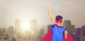 Boy in red superhero cape and mask showing fists Royalty Free Stock Photo