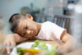 Boy Refusing To Eat Salad With Healthy Vegetables.