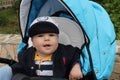 The boy relaxed in the blue stoller Royalty Free Stock Photo
