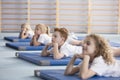 Boy relaxing on blue mat