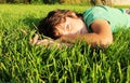 Boy relaxing on grass Royalty Free Stock Photo