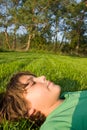 Boy relaxing on grass Royalty Free Stock Photo