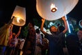 A boy releases a floating lantern in Chiang Mai, Thailand